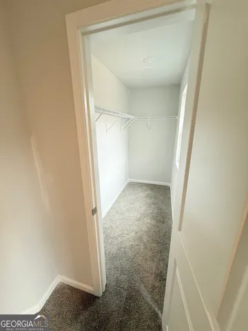 an empty room with a empty space and window