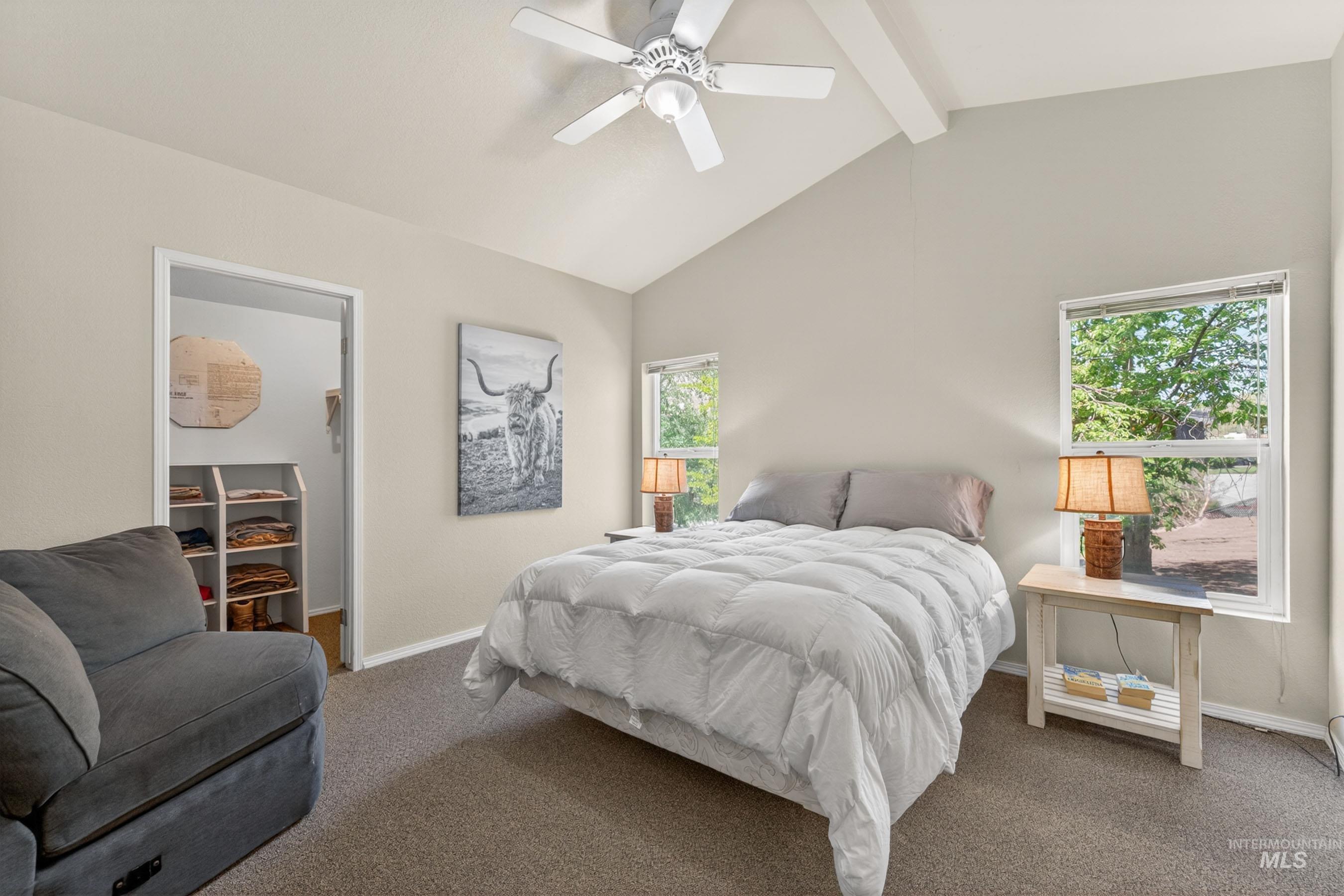 151 Cow Creek Road Lucile, ID 83542 - Photo 22 of 50 Vaulted ceilings with exposed beams and a ceiling fan