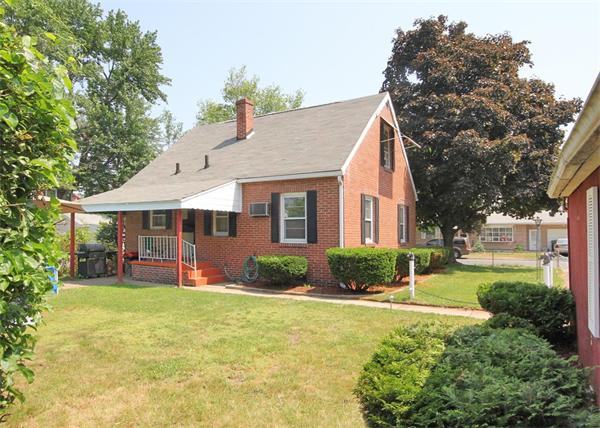 248 Merrimac Avenue Springfield, MA 01104 - Photo 4 of 16 a view of a house with a yard and sitting area