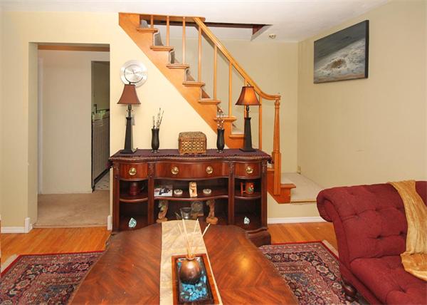 248 Merrimac Avenue Springfield, MA 01104 - Photo 5 of 16 a living room with furniture and a fireplace