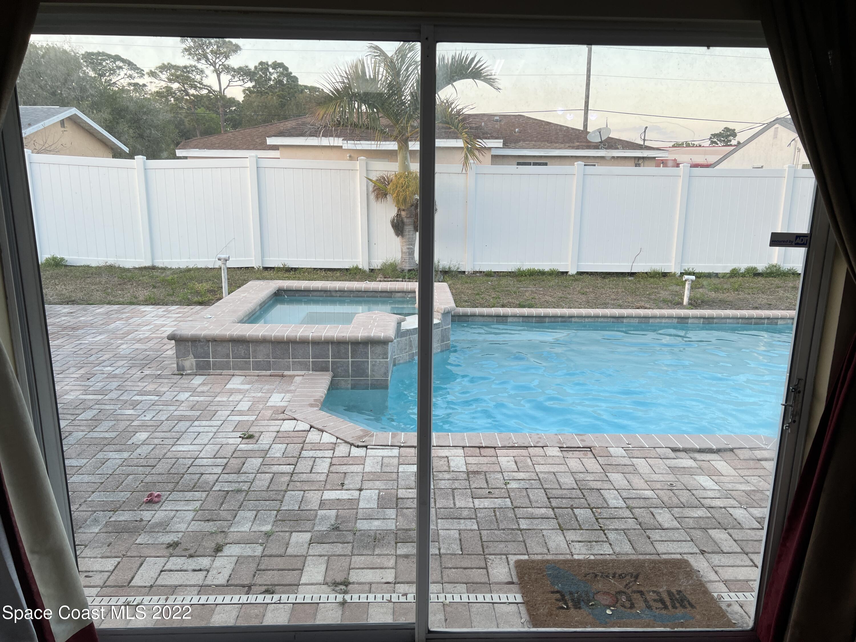 1873 Cleveland Street Northeast Palm Bay, FL 32905 - Photo 15 of 28 a bathroom with a shower