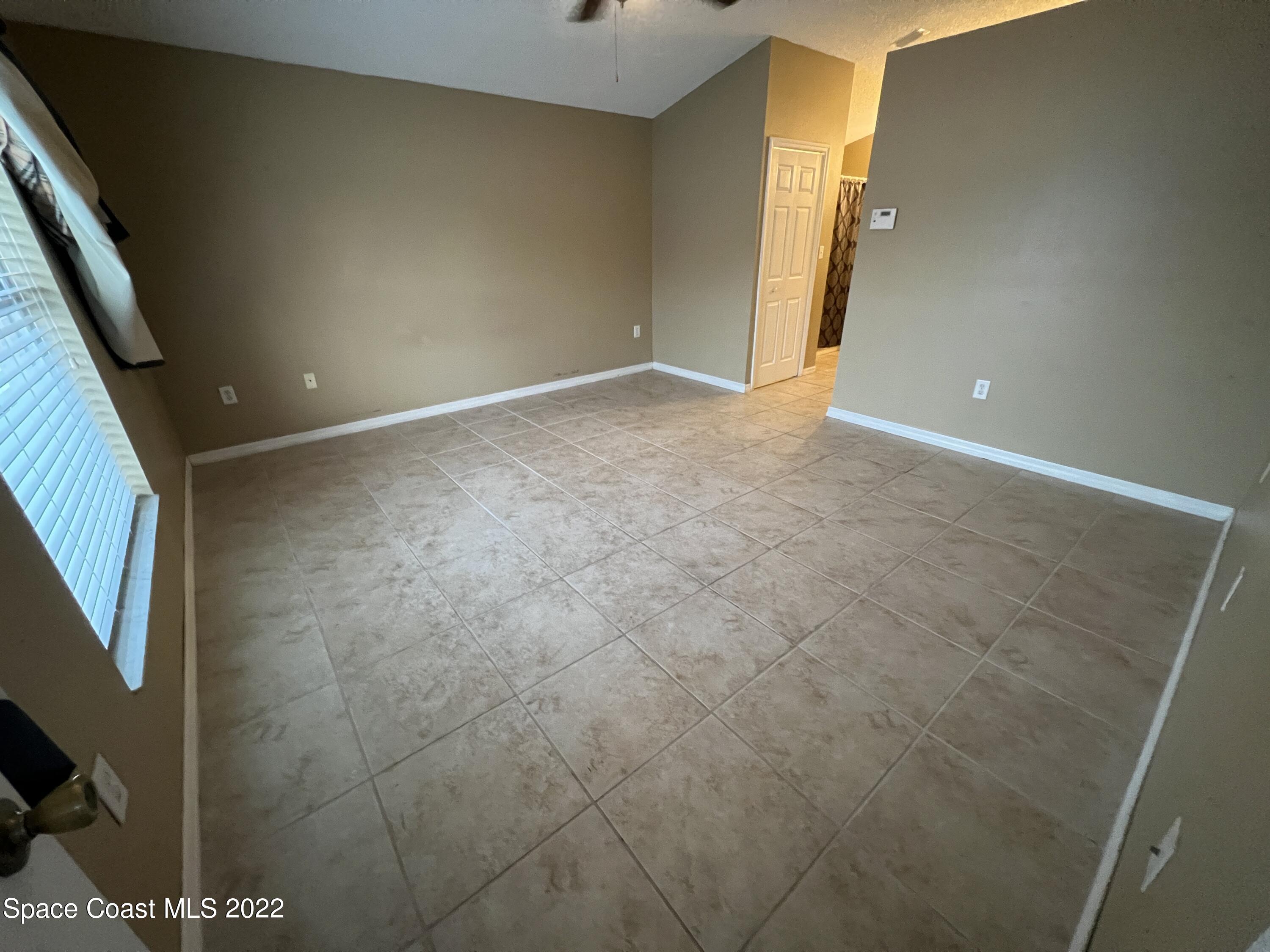 1873 Cleveland Street Northeast Palm Bay, FL 32905 - Photo 16 of 28 a view of an empty room with a window