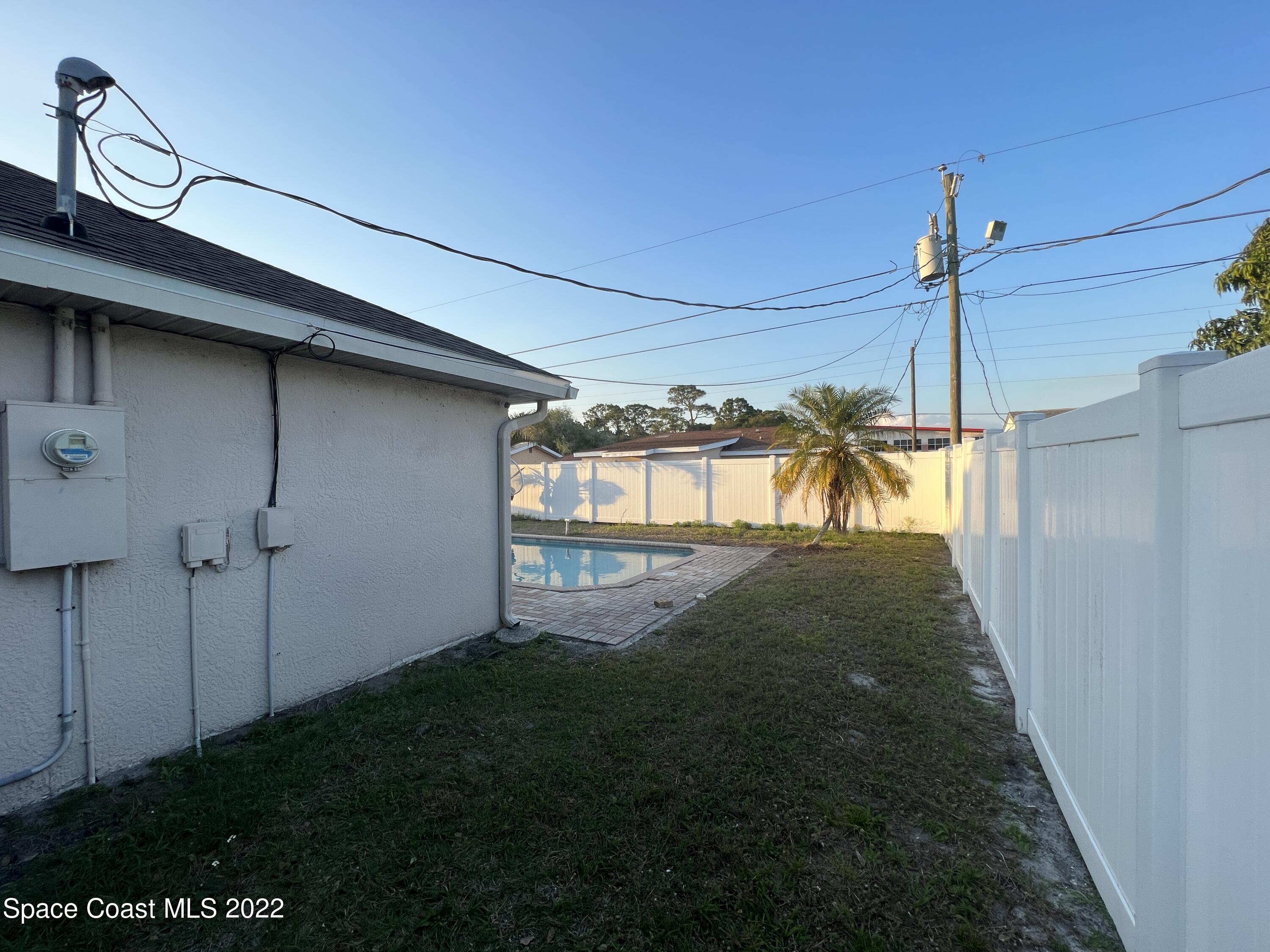 1873 Cleveland Street Northeast Palm Bay, FL 32905 - Photo 6 of 28 a view of a yard