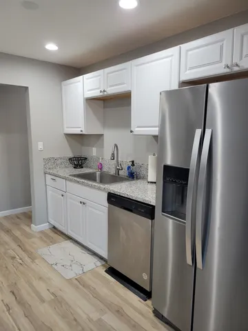 a kitchen with a sink and cabinets