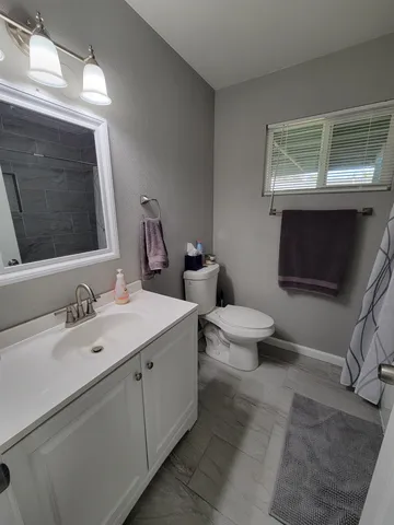 a bathroom with a shower and a bath tub