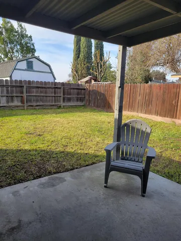 a front view of house with outdoor seating