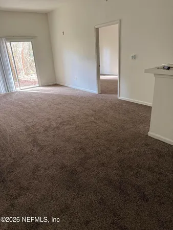 a view of an empty room and window