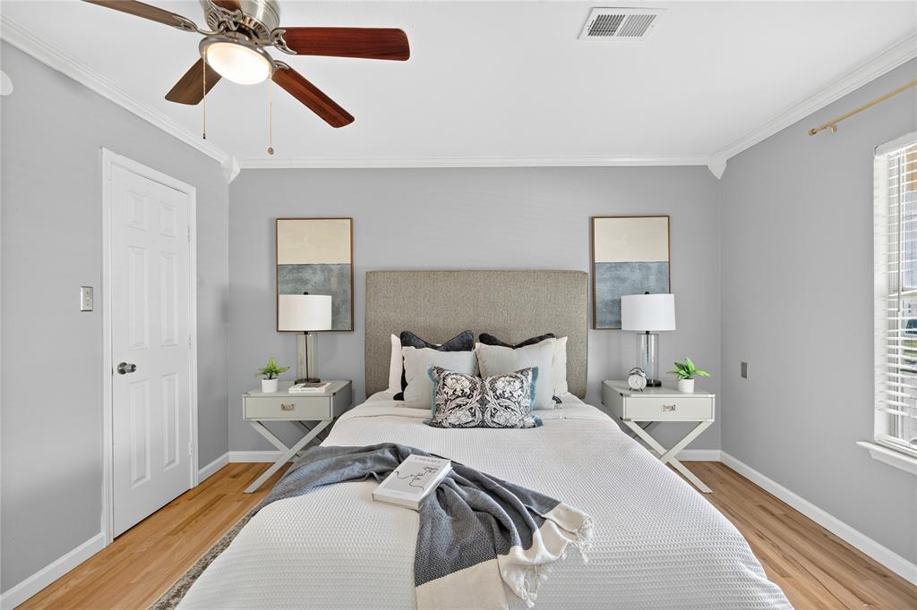 649 Peavy Road Dallas, TX 75218 - Photo 11 of 30 Wood-finish flooring, crown molding, and a ceiling fan with integrated lighting