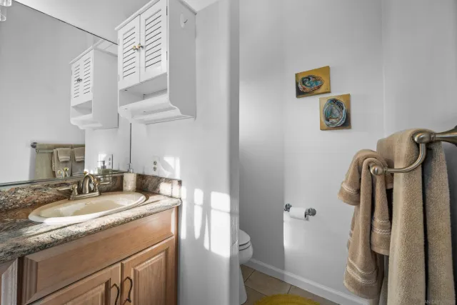 a bathroom with a sink a mirror and a shower