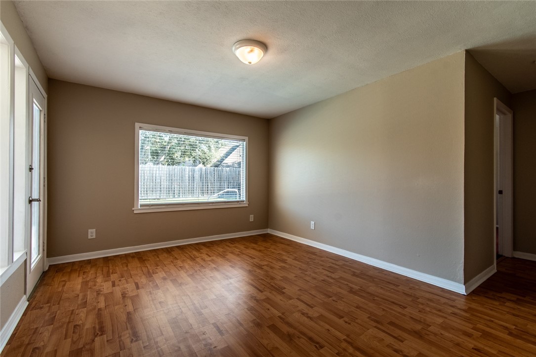 4822 Trinity Drive Corpus Christi, TX 78411 - Photo 13 of 25 A large picture windows offer natural light and a