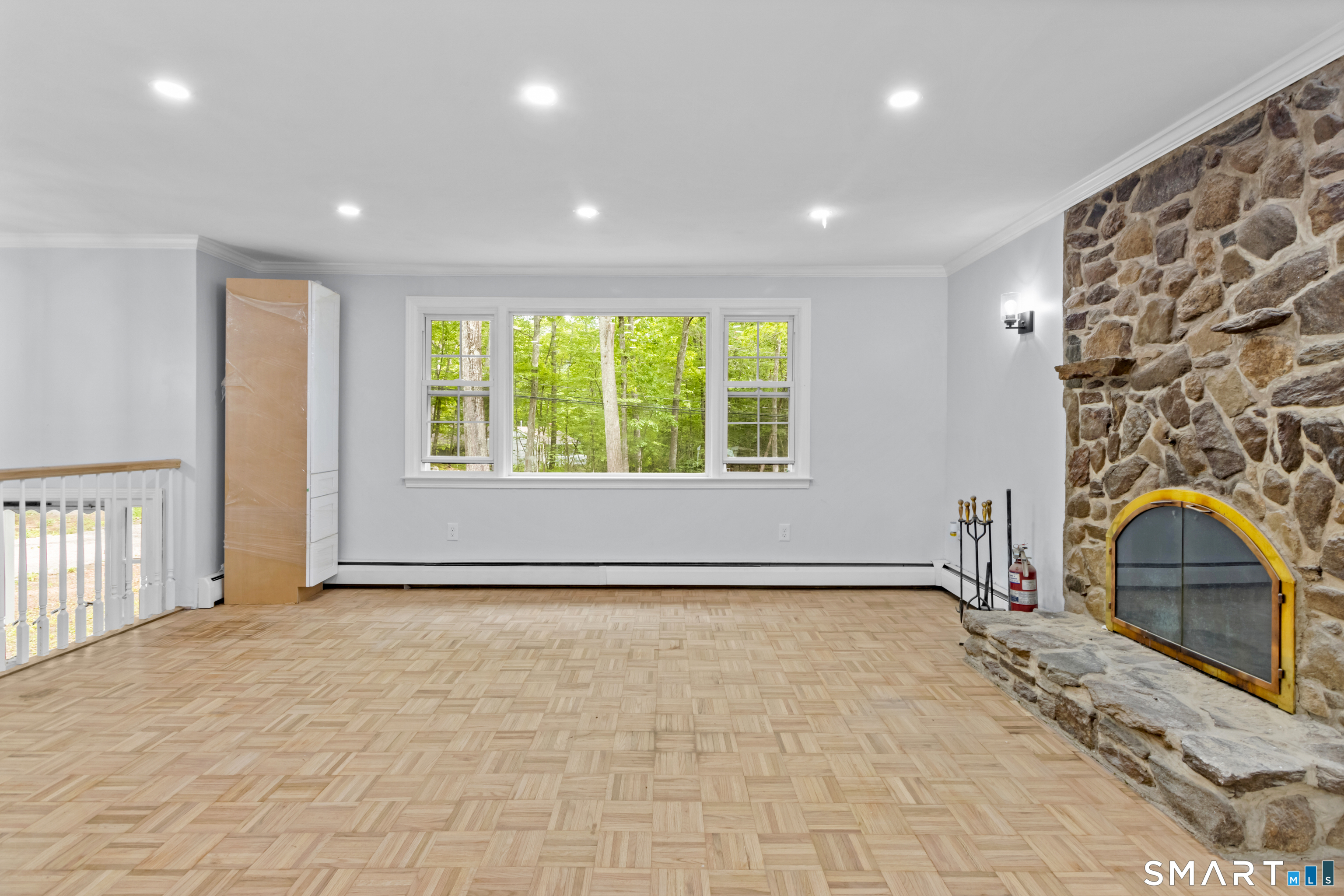 20 Quiet Woods Road East Hampton, CT 06424 - Photo 5 of 40 a view of empty room with a fireplace and a window