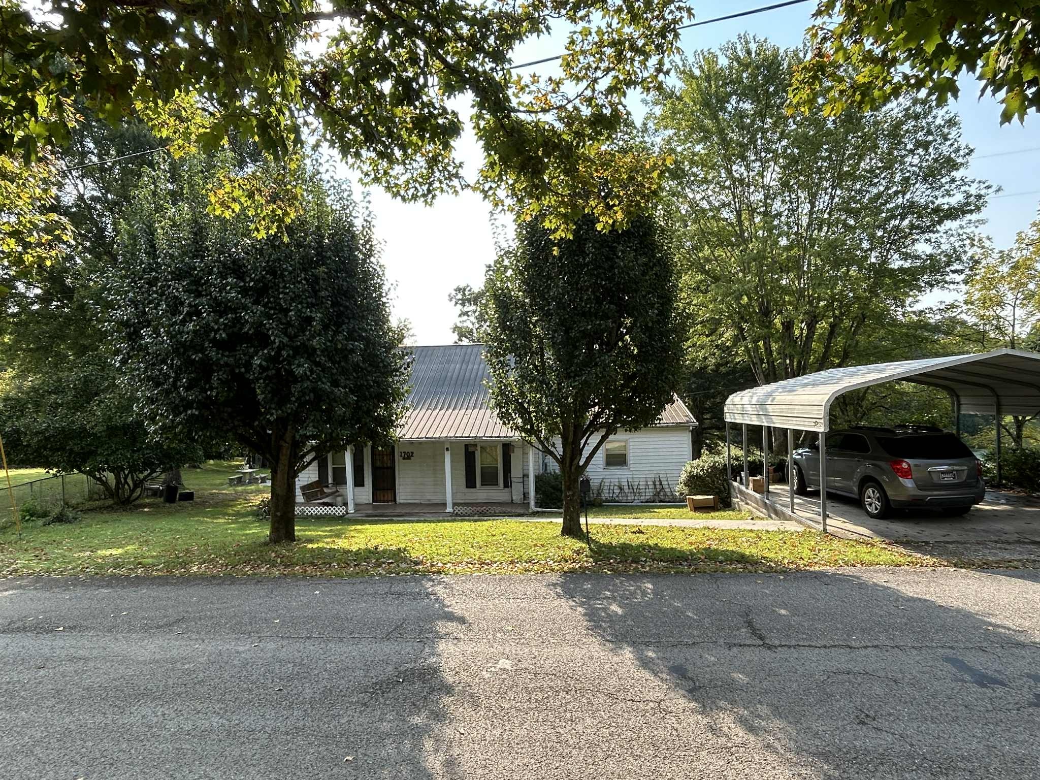 1702 Johnson Chapel Road Sparta, TN 38583 - Photo 2 of 9 a view of a patio with swimming pool of the house