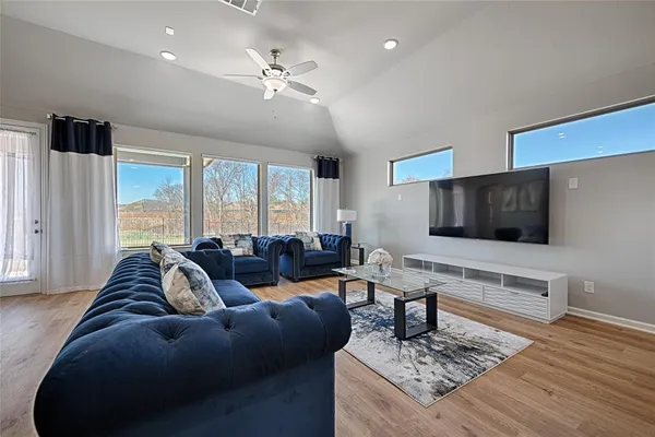 a living room with furniture and a flat screen tv