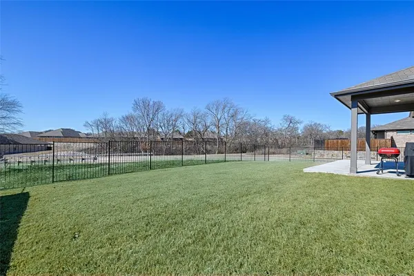 a view of a deck and a big yard