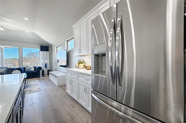 a kitchen with sink cabinets and stainless steel appliances