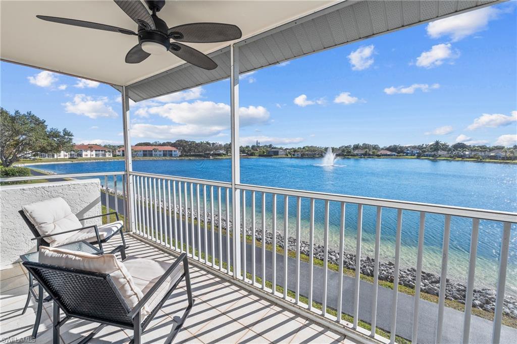 541 Windsor Square Naples, FL 34104 - Photo 11 of 25 a view of a balcony with furniture and wooden floor