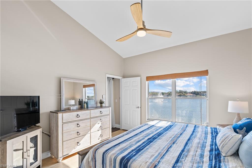 541 Windsor Square Naples, FL 34104 - Photo 16 of 25 a bedroom with a bed and a flat screen tv