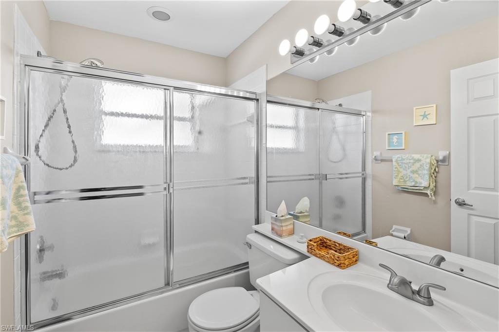 541 Windsor Square Naples, FL 34104 - Photo 20 of 25 a bathroom with a sink toilet and shower