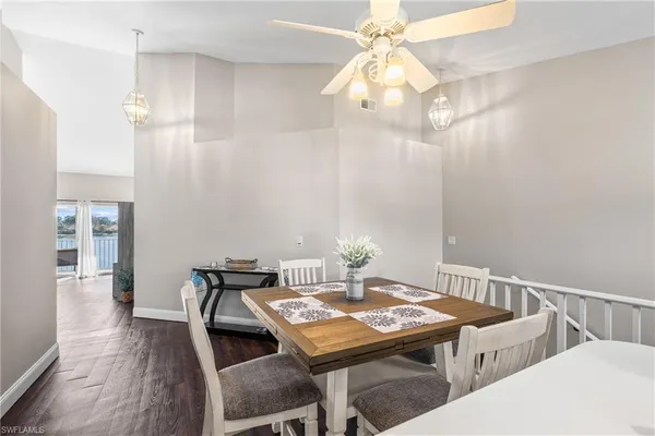 a view of a dining room with furniture and wooden floor
