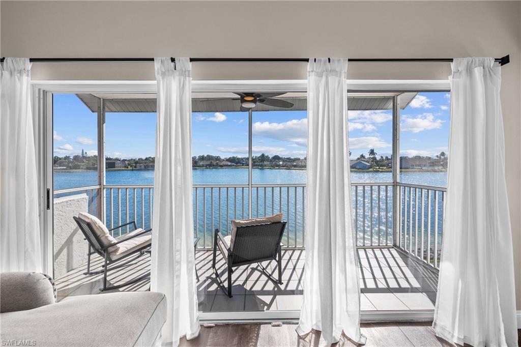 541 Windsor Square Naples, FL 34104 - Photo 10 of 25 a view of a living room and windows