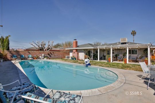 429 West Perdew Avenue Ridgecrest, CA 93555 - Photo 48 of 50 an outdoor space with swimming pool and furniture
