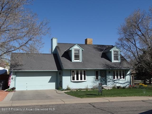 960 Cedar Drive Rifle, CO 81650 - Photo 1 of 27 a front view of a house with garden