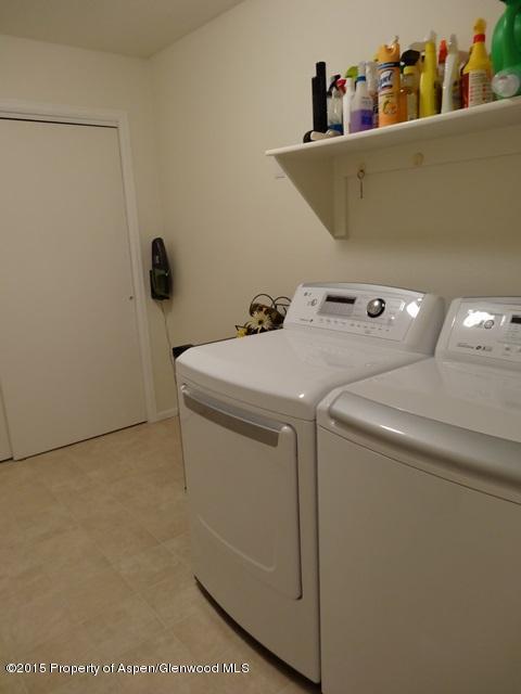 960 Cedar Drive Rifle, CO 81650 - Photo 11 of 27 a utility room with dryer and washer
