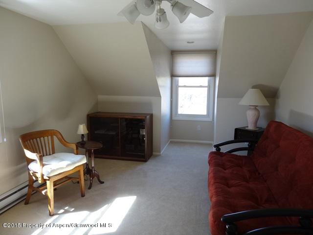 960 Cedar Drive Rifle, CO 81650 - Photo 14 of 27 a living room with furniture and a fireplace