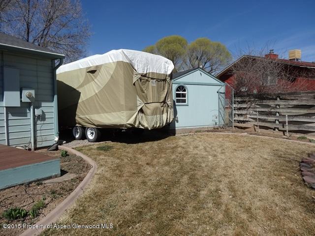 960 Cedar Drive Rifle, CO 81650 - Photo 16 of 27 a view of a house with a snow in the yard