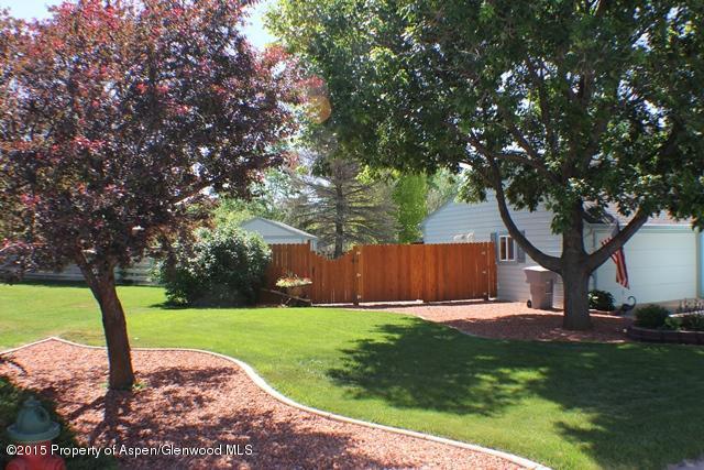 960 Cedar Drive Rifle, CO 81650 - Photo 23 of 27 a view of a backyard with a garden