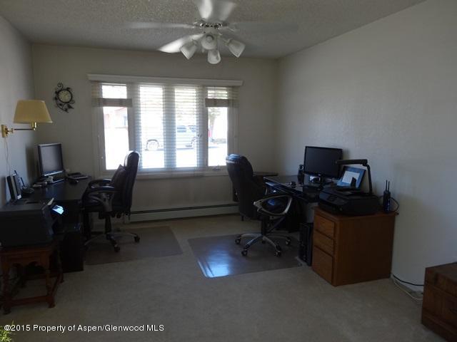 960 Cedar Drive Rifle, CO 81650 - Photo 7 of 27 a living room with furniture and a flat screen tv