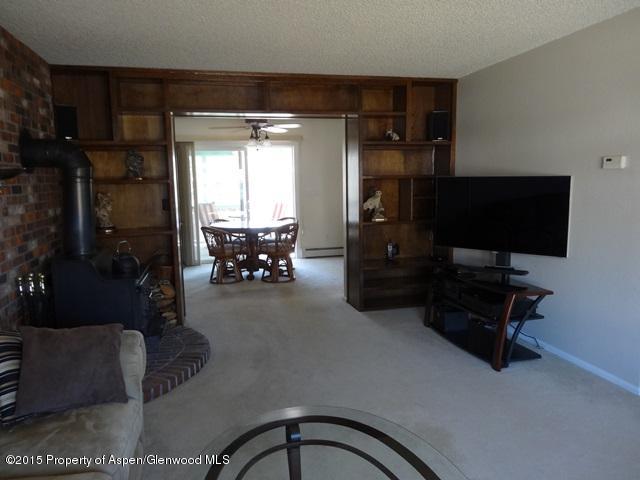 960 Cedar Drive Rifle, CO 81650 - Photo 8 of 27 a living room with furniture and a flat screen tv