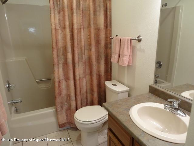 960 Cedar Drive Rifle, CO 81650 - Photo 9 of 27 a bathroom with a sink toilet and shower