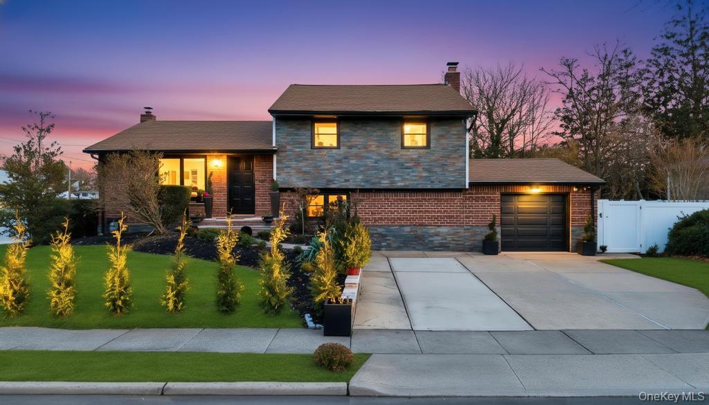 8 Barbara Lane Jericho, NY 11753 - Photo 1 of 1 a front view of a house with garden