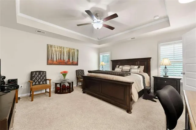 a bedroom with bed and window