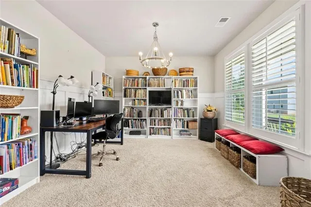 a bedroom with furniture and a book shelf