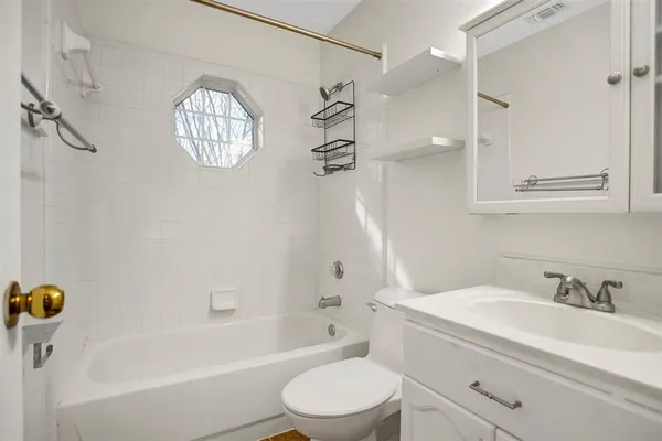 a bathroom with a sink a toilet and a bathtub