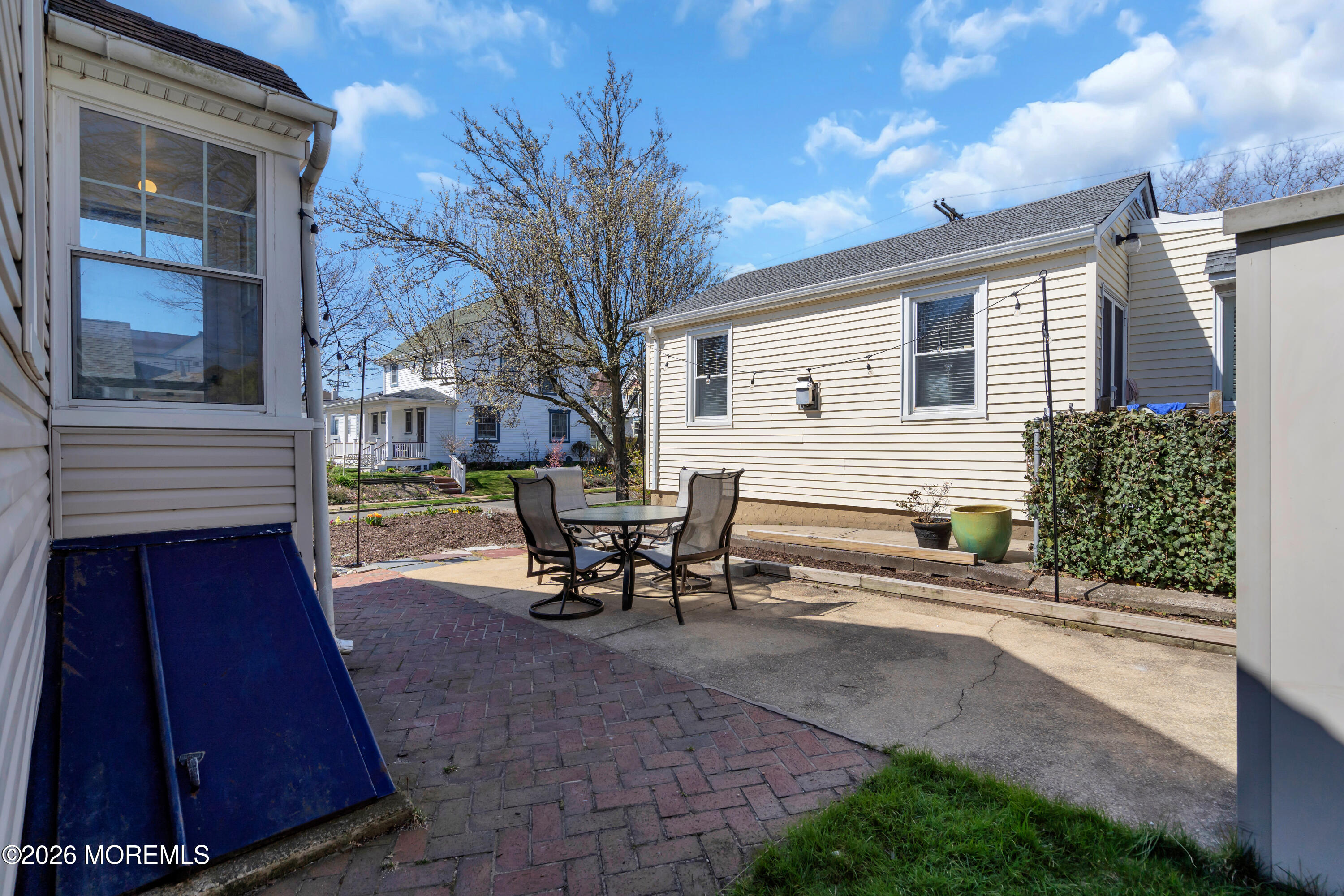 137 Inskip Avenue Ocean Grove, NJ 07756 - Photo 6 of 39 a view of a outdoor space with a patio and sitting area