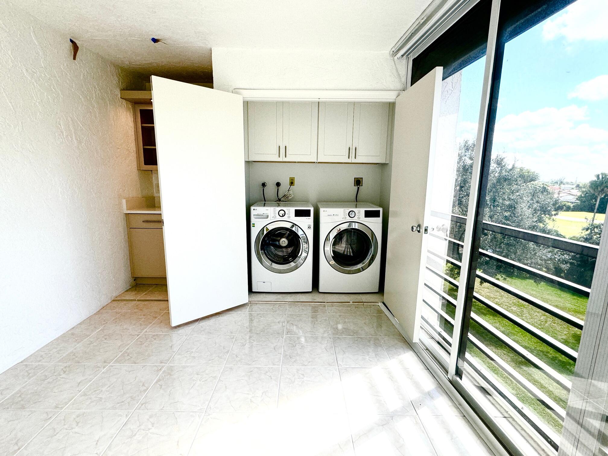 9170 Southwest 14th Street, Unit 4405 Boca Raton, FL 33428 - Photo 7 of 48 a utility room with dryer and washer