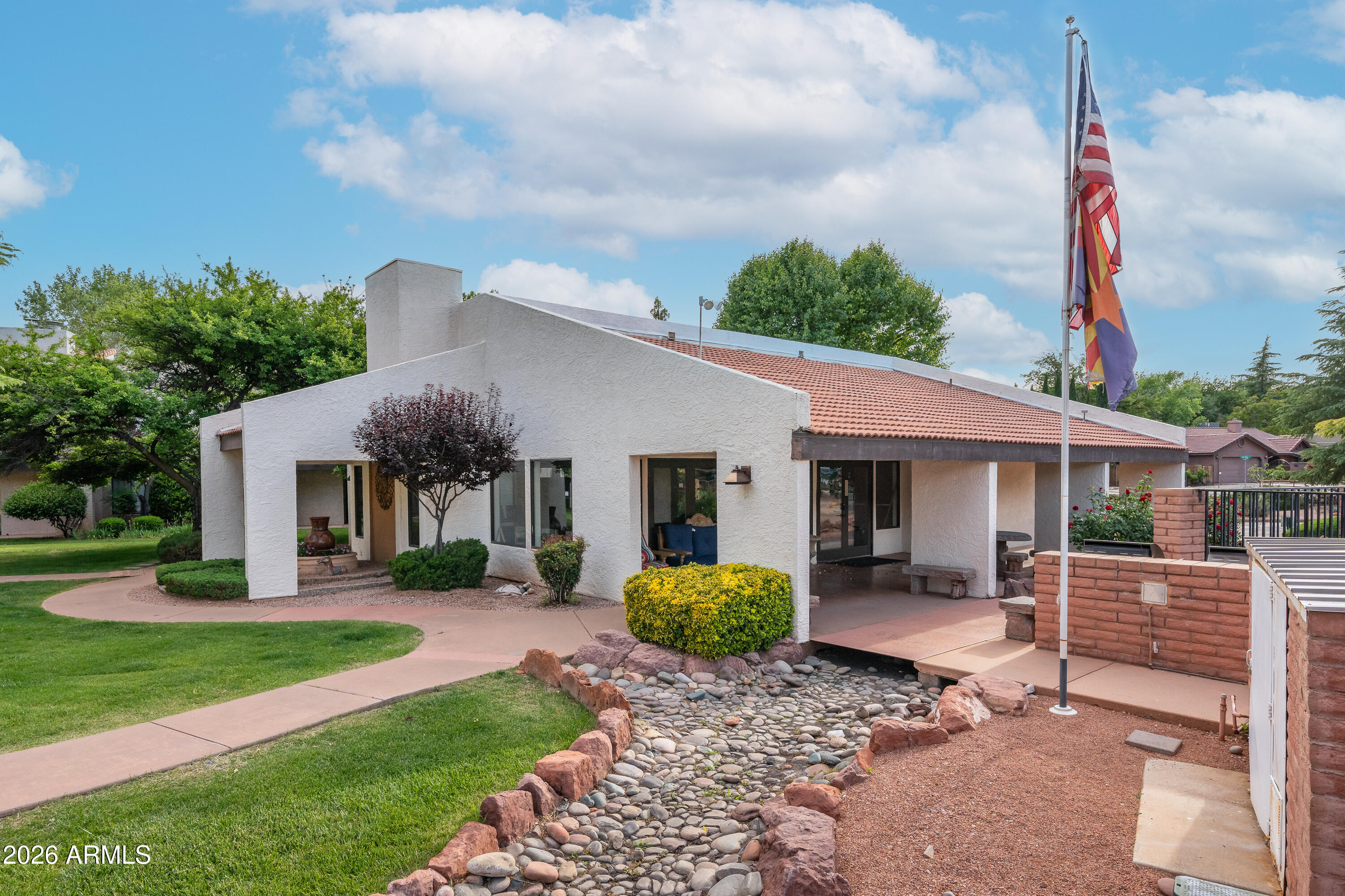 65 Verde Valley School Road, Unit B14 Sedona, AZ 86351 - Photo 12 of 25 a view of a house with backyard and a tree
