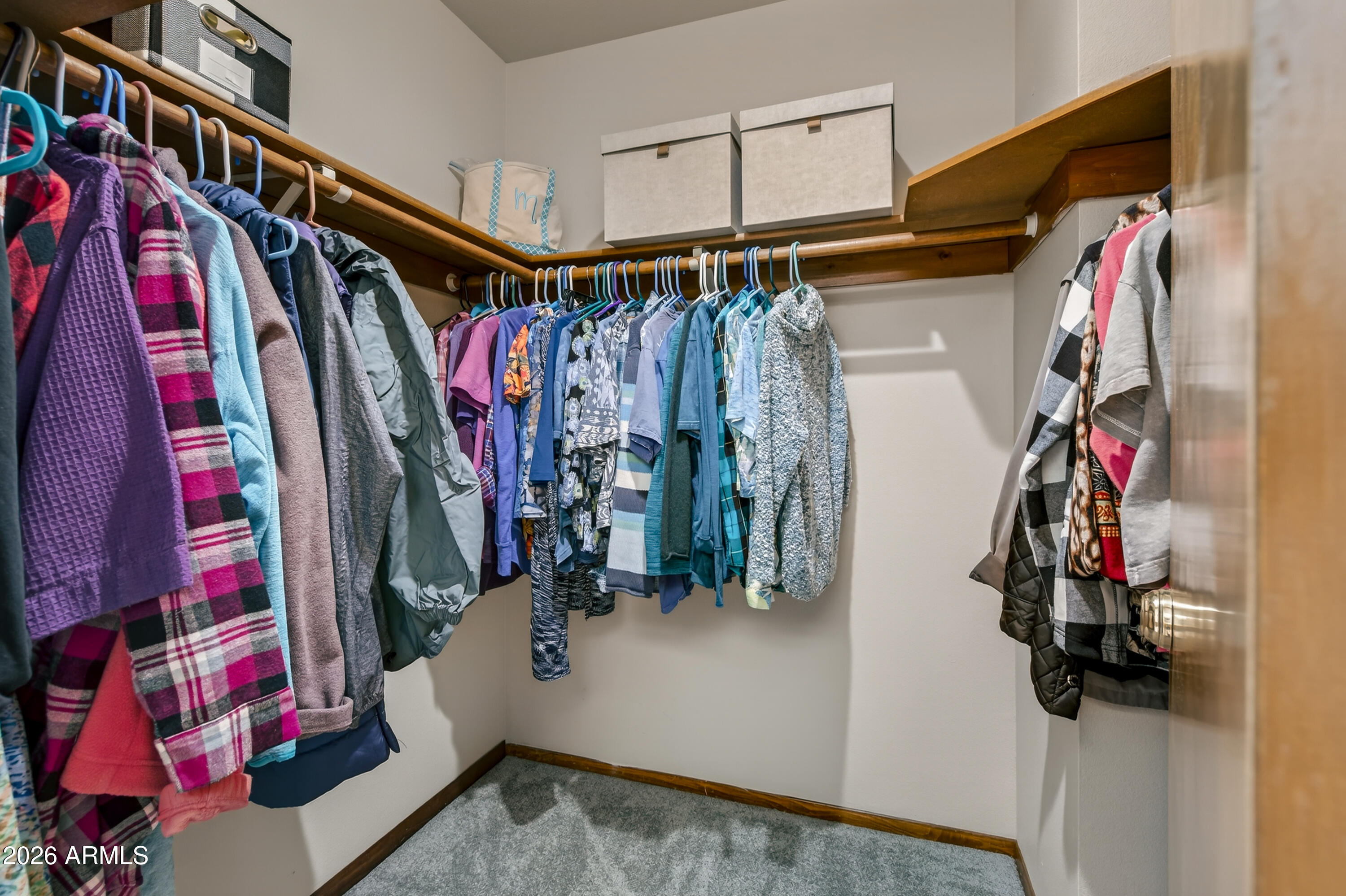 65 Verde Valley School Road, Unit B14 Sedona, AZ 86351 - Photo 18 of 25 a view of walk in closet with clothes and shoes