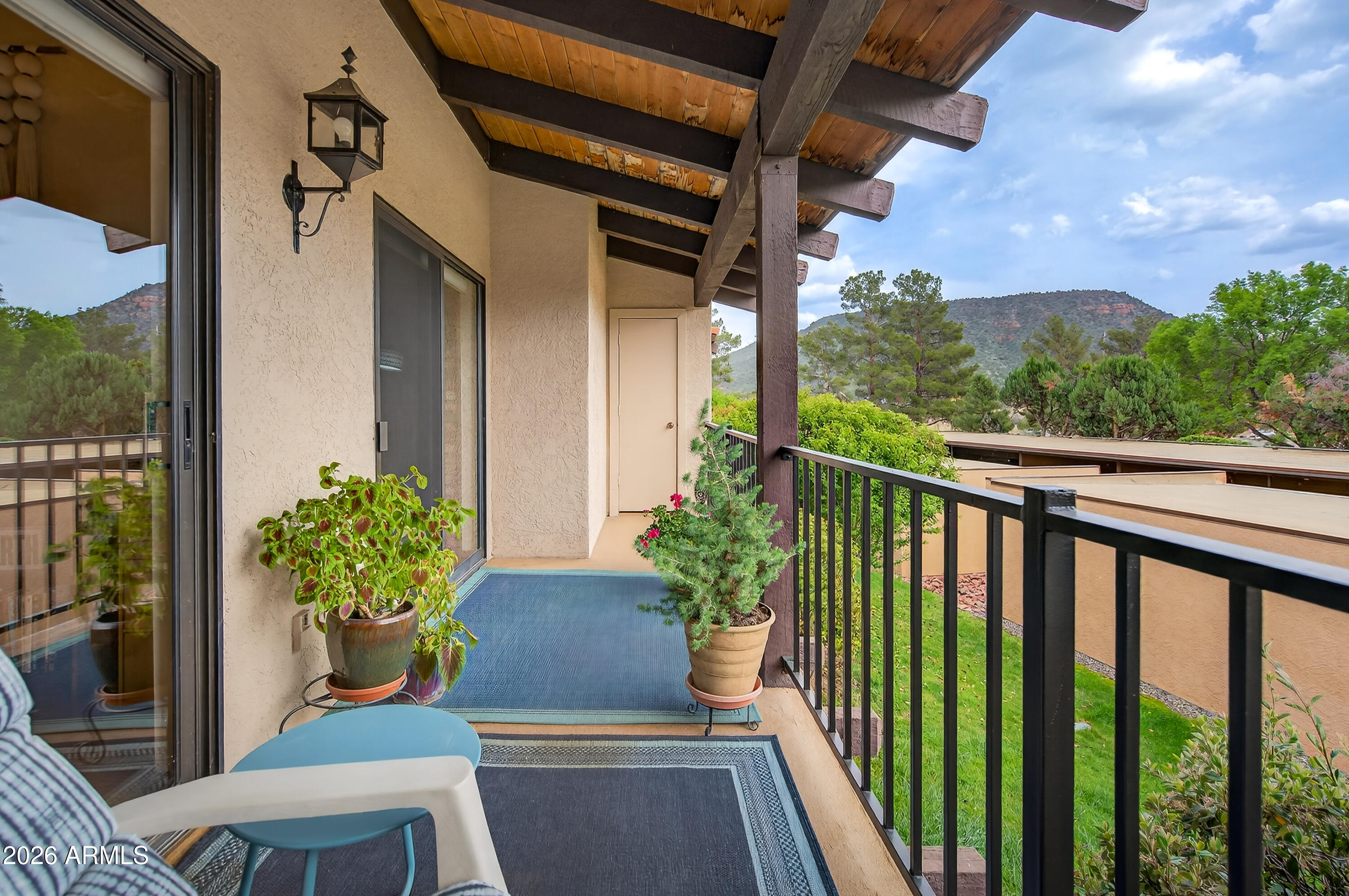 65 Verde Valley School Road, Unit B14 Sedona, AZ 86351 - Photo 23 of 25 a balcony with couple of flower plants