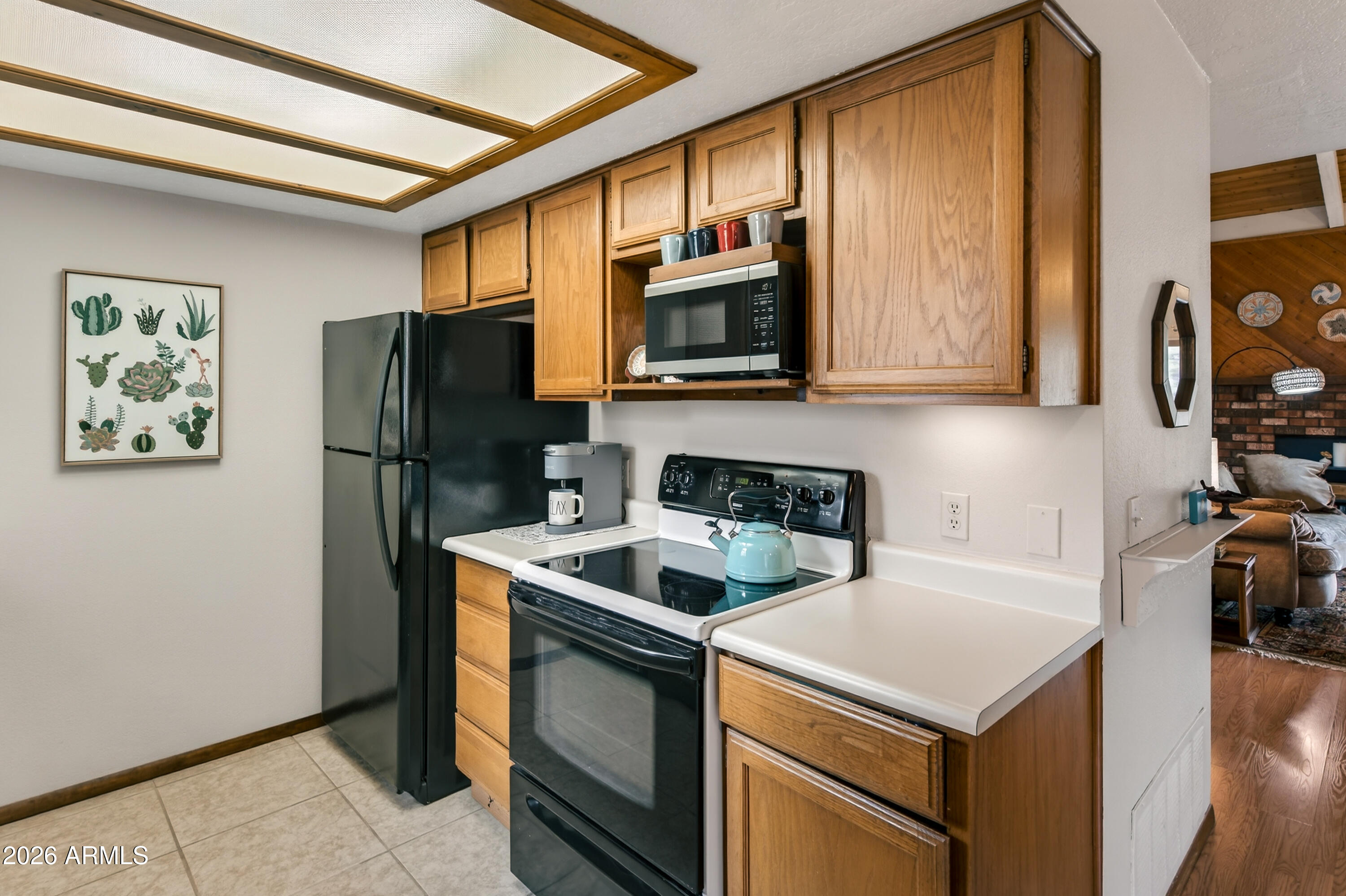 65 Verde Valley School Road, Unit B14 Sedona, AZ 86351 - Photo 10 of 25 a kitchen with stainless steel appliances a stove microwave and refrigerator