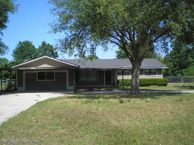 54086 Dornbush Road Callahan, FL 32011 - Photo 1 of 1 a front view of a house with a yard
