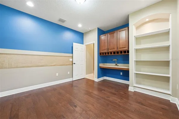a bathroom with a double vanity sink and mirror