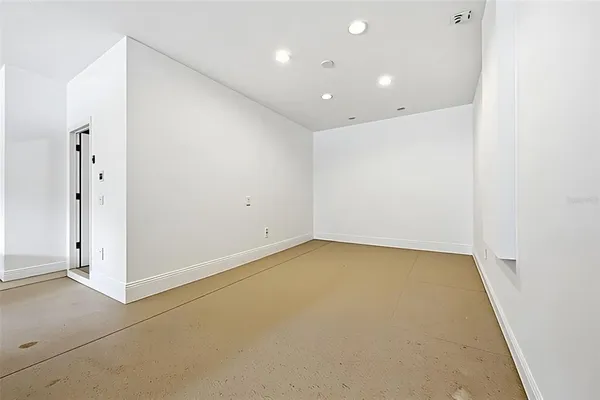 a spacious bathroom with a tub sink and mirror