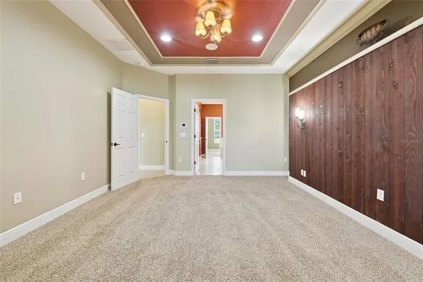an empty room with closet and wooden floor