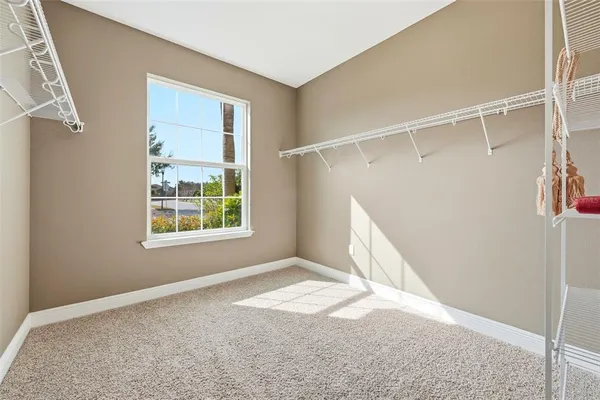 a bathroom with a glass shower door and a glass door