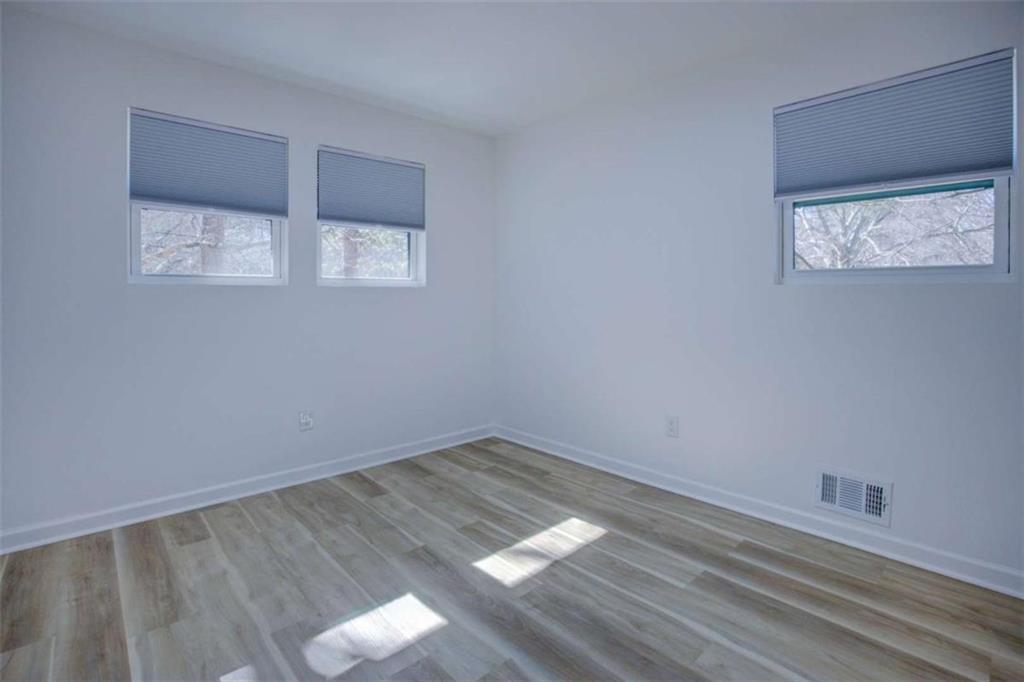 7225 Pineneedle Drive Southwest Covington, GA 30014 - Photo 24 of 37 wooden floor in an empty room