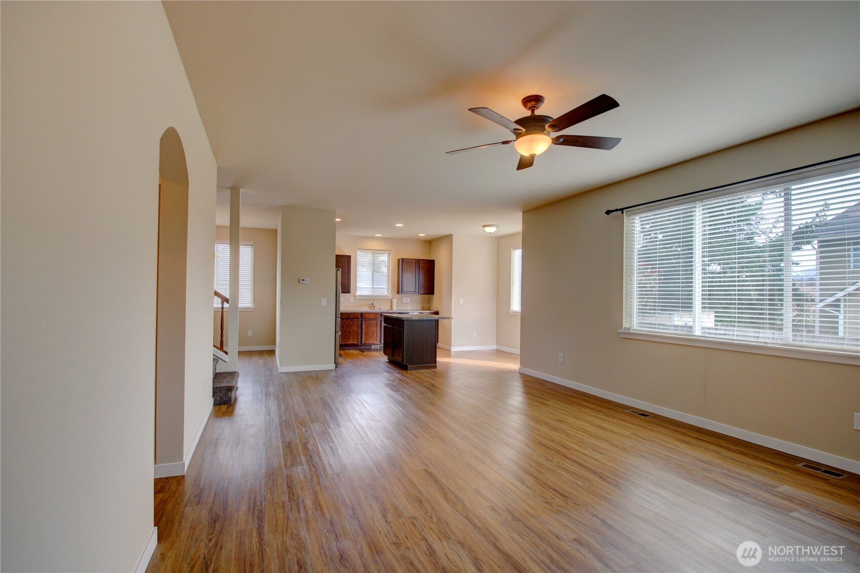 1709 Hillcrest Loop Mount Vernon, WA 98274 - Photo 13 of 40 a view of an empty room with a window and wooden floor